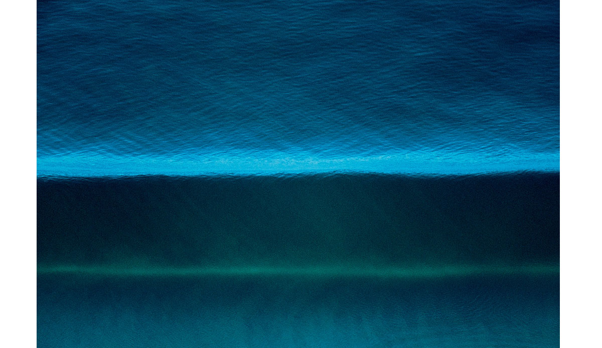 As I continued to transform my work, I found myself looking for anything different that I thought might make for an impactful image.  This photo was shot with a long lens looking almost straight down on a clean wave rolling into Blacks Beach. Photo: <a href=\"https://anthonyghigliaprints.com/\">Anthony Ghiglia</a>