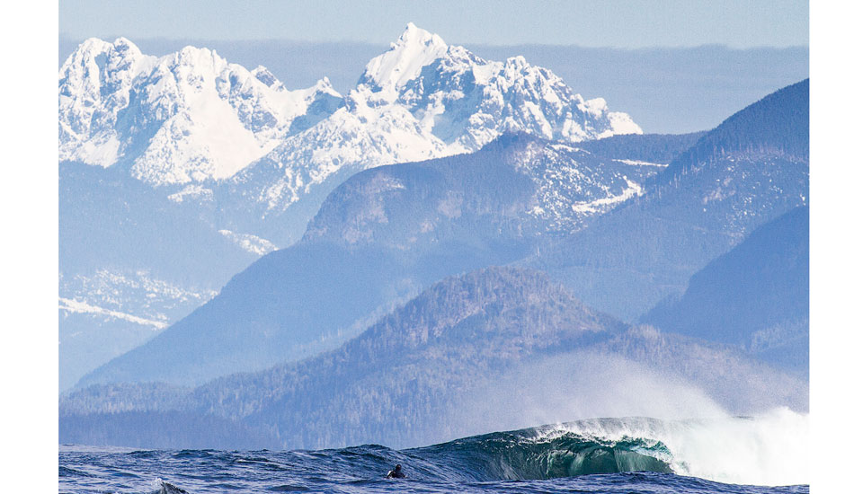 Raph Bruhwiler paddling out for another where the mountains meet the sea. Photo: <a href=\"https://markmcinnis.com/\" target=_blank>Mark McInnis</a>