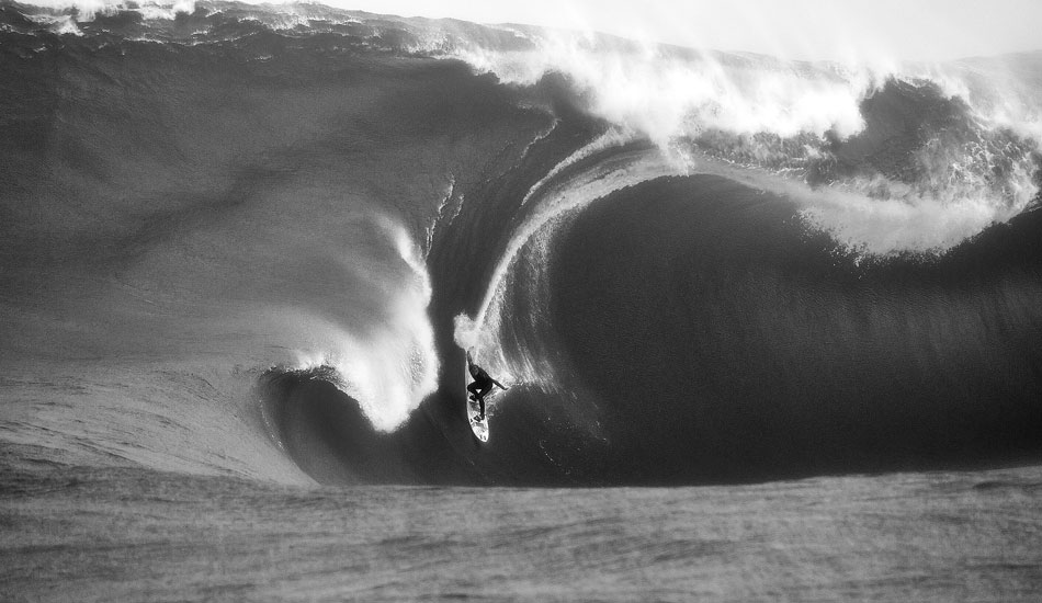 Paul Paterson, The Right: Twiggy Baker had flown over from home for a 50/50 session at The Right. The wind was suss, and the swell maybe not big enough, but he took the punt and teamed up with Paul Paterson (Antman) for the session. One tow team, myself and Darren McCagh were behind the cameras. When it goes wrong out in the middle of the ocean, everything is magnified. This is Paul Paterson just about to get the beating of his life on a wave that was from the wrong direction which, by the way, you can\'t see before you let go of the rope. If Paul Paterson was not as experienced as he is, we would have lost him to the ocean. After a two and half wave hold down (the half being a wave that just surged), and bursting his ear drums,Twiggy pulled him out the water face down trying to right himself which was difficult with the ear problem. Basically he was just border line o.k (he is a tough little bastard). The way he described the incident back at the car-park was incredible: super calm under such extreme pressures. His life depended on his past experiences which has transformed the way I look at my own circumstances. You surely have to build up to such levels. Cheers Antman. 
Photo: <a href=\"https://www.russellord.com\" target=\"_blank\">Russell Ord</a>