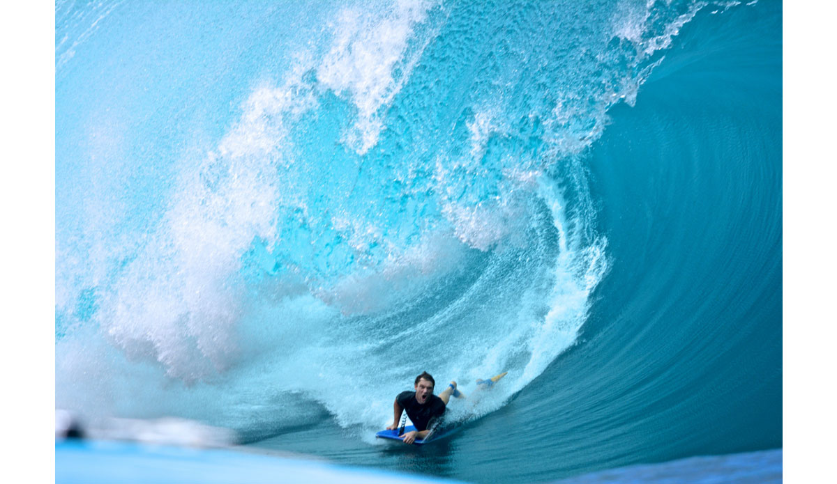 Unknown boogie boarder. Love his facial expression and the color or the wave. I think he\'s stoked! Photo: Kenna Colburn