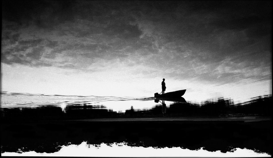 This one is a controversial image in the documentary world. It\'s taken less than a half kilometre from home. The kid in the boat is probably around 12, and I just love that sense of being alone on the water. Photo: <a href=\"https://www.submerge.com.au\" target=_blank>Dean Dampney</a>.