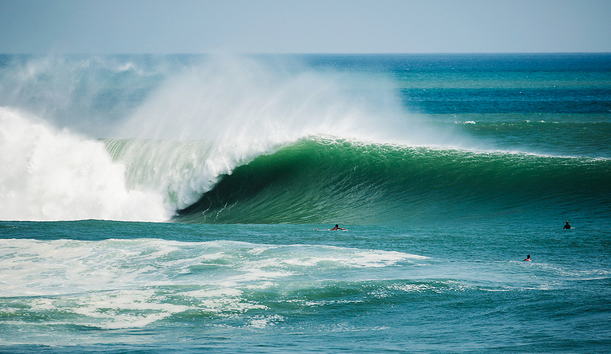 The Outer Reef at Popoyo in Nicaragua. I shot this in May of this year (2015) during the huge south swell we got at the beginning of the month. I booked my ticket the night before the peak of the swell and arrived to this the next morning straight off the plane. This shot makes the wave look a lot more perfect than it really is. What you don’t see here is the boils on the face in the take off zone, steps that need navigating and wide sets that can clean you up and smash you into the sharp ledgy reef which is only a few feet below the surface. Wave selection is critical and it was quite the experience to see this spot going off. Photo: <a href=\"https://evanconwayphoto.com/\">Evan Conway</a>