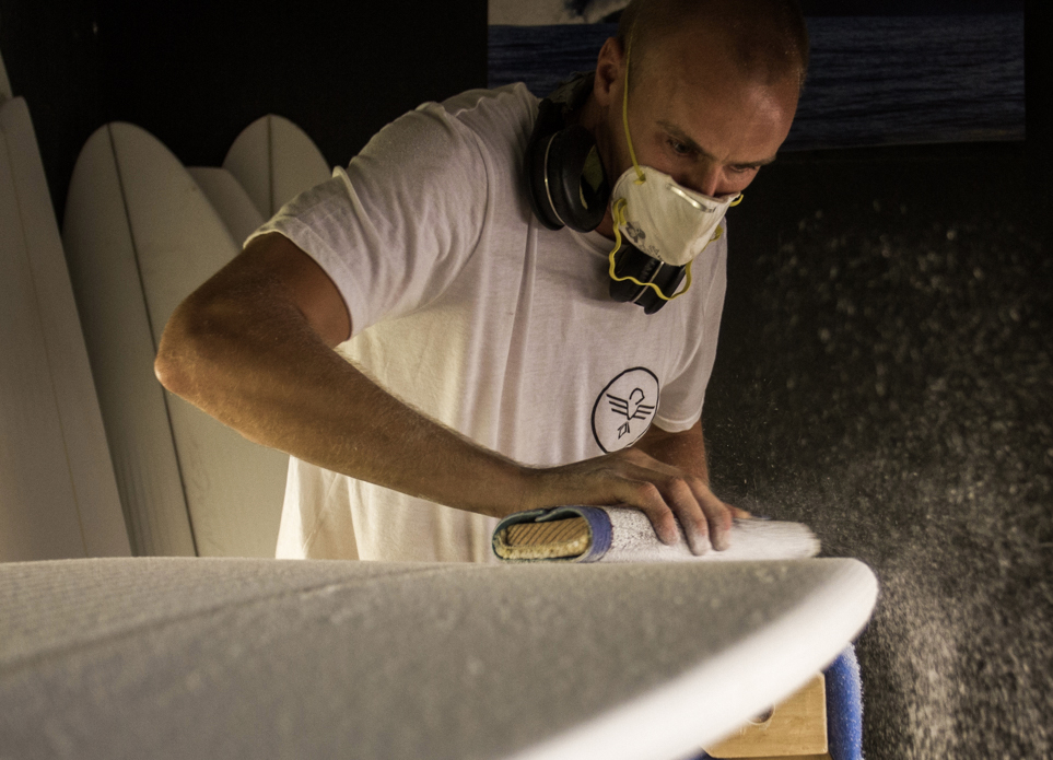 Behind-the-scenes look into the working people of the surfing world. Here\'s Drew Sparrow
shaping boards for North Shore locals and big-waves surfers from all over the world.  Photo: <a href=\"https://www.shigephoto.co/\">Gavin Shige</a>