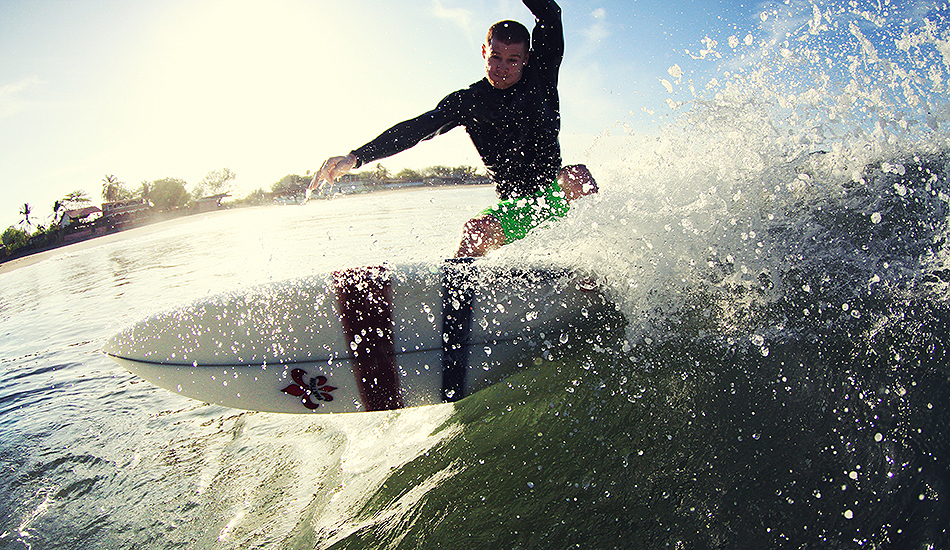 My friend Tom putting his new board on rail at the beachbreak around the point. Photo: Greg Heine