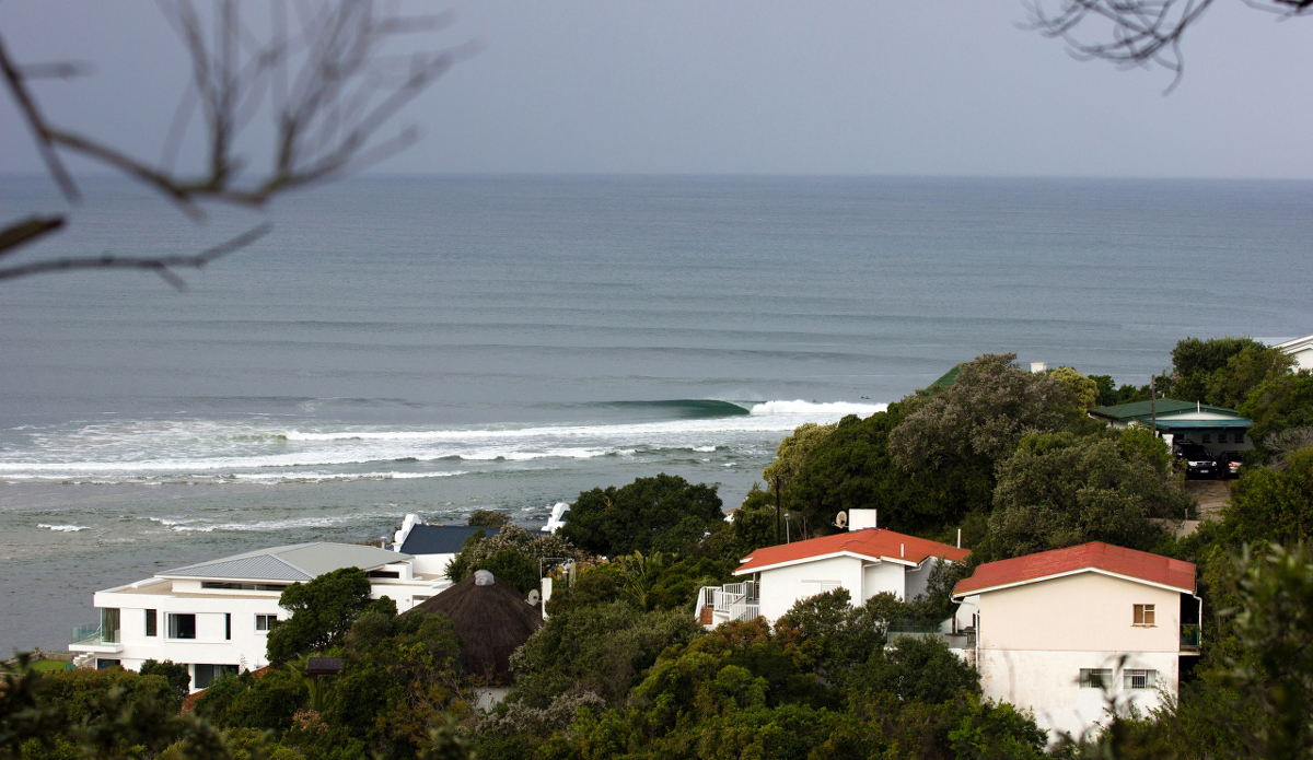 This setup was about a five hour drive from Cape Town up the east coast and about an hour from J-Bay. During my most recent stay, it looked like this for four days straight. One afternoon, I met some California surfers who had surfed it before driving on to J-Bay, but quickly came back. They couldn\'t believe people were hassling over two-foot Supertubes when this had four guys out and was five feet. The day after this short was taken, a huge storm hit with pouring rains that flooded the river and burst its banks. Since then, the river banks silted up and the wave no longer exists... Photo: <a href=\"https://www.ijtphoto.weebly.com/\">Ian Thurtell</a>