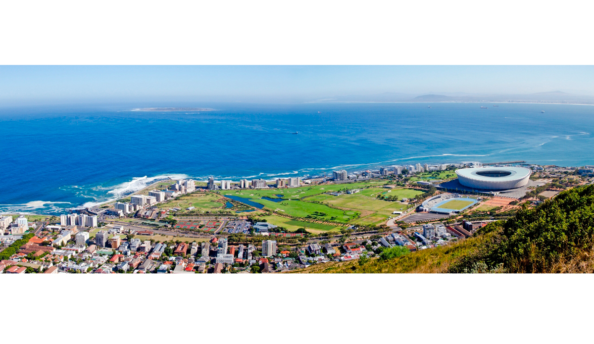 This is the view from Lion\'s Head, part of Table Mountain, looking down onto Sea Point, Green Point, and the 2010 World Cup football (soccer) stadium. In the top left side you are able to see Robben Islan where freedom fighter Nelson Mandela was incarcerated for 18 years. Photo: <a href=\"https://www.ijtphoto.weebly.com/\">Ian Thurtell</a>