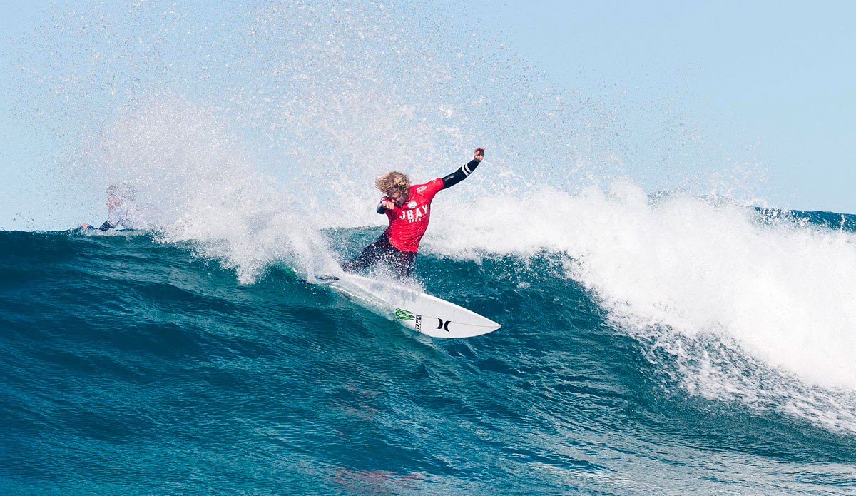 John John Florence of Oahu, Hawaii (pictured) advanced into Round 3 of the Jeffreys Bay Open, defeating Bede Durbidge (AUS) and Jeremy Flores (FRA) with a heat total of 13.74 points (out of a possible 20.00) in Round 1 at Supertubes, Jeffreys Bay today. Photo: <a href=\"https://www.aspworldtour.com/\">ASP</a>/Cestari