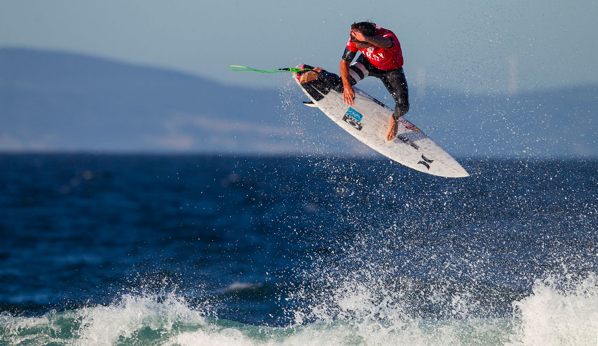 ulian Wilson of Sunshine Coast, Australia (pictured) won his Round 2 heat at the J-Bay Open landing a huge Alley-Oop aerial manuever to score a near perfect 9.33 (out of a possible 10.00) on Thursday July 10, 2014. Wilson defeated Glen Hall (AUS) and advanced into Round 3. The J-Bay Open, stop No. 6 of 11 on the 2014 Samsung Galaxy ASP World Championship Tour was called ON today for Round 1. Photo: <a href=\"https://www.aspworldtour.com/\">ASP</a>/<a href=\"https://www.kirstinscholtz.com/\"> Kirstin Scholtz</a>