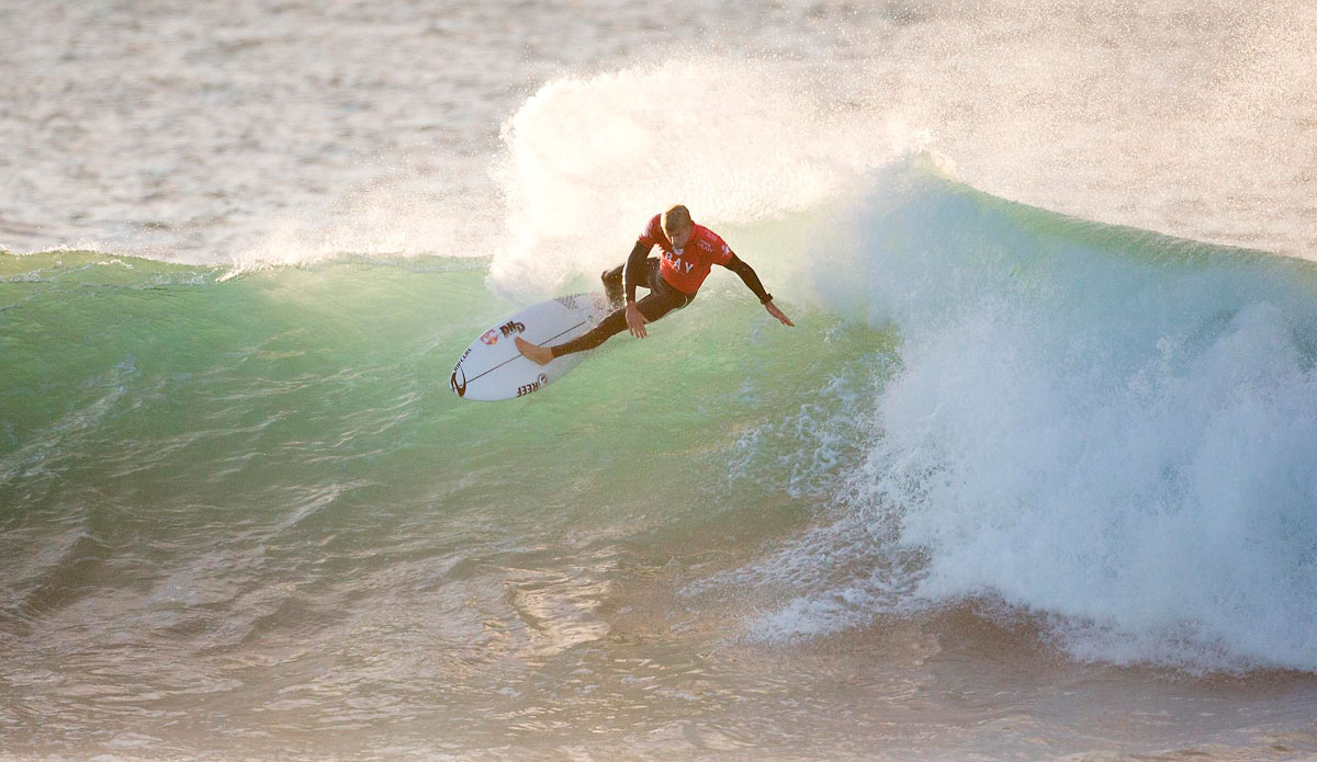 Current 3-times ASP World Champion Mick Fanning of Tweed Heads, NSW, Australia (pictured) advanced into Round 3 of the Jeffreys Bay Open, defeating Sebastien Ziets (HAW) and Dion Atkinson (AUS) with a heat total of 15.00 points (out of a possible 20.00) in Round 1 at Supertubes, Jeffreys Bay today. Photo: <a href=\"https://www.aspworldtour.com/\">ASP</a>/Cestari