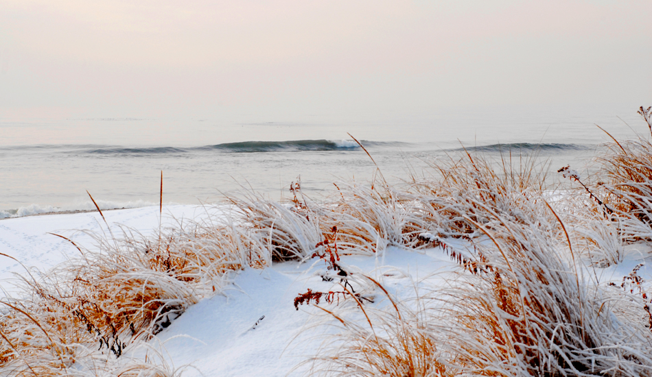 Snowy days at the beach are usually stormy and windy, but this particular morning was calm and glassy.  Photo: <a href=\"https://www.timelessride.com\">Jim Cook</a>