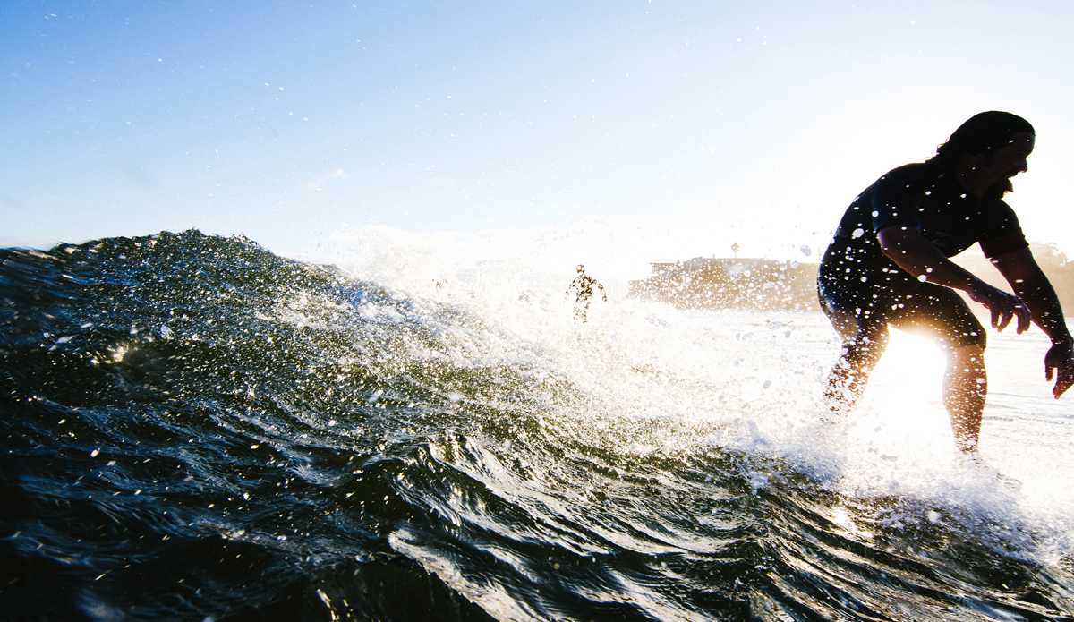 Sharing the stoked with a little tongue. Photo: <a href=\"https://www.lookdontspeak.com\">Andrew Simoni</a>