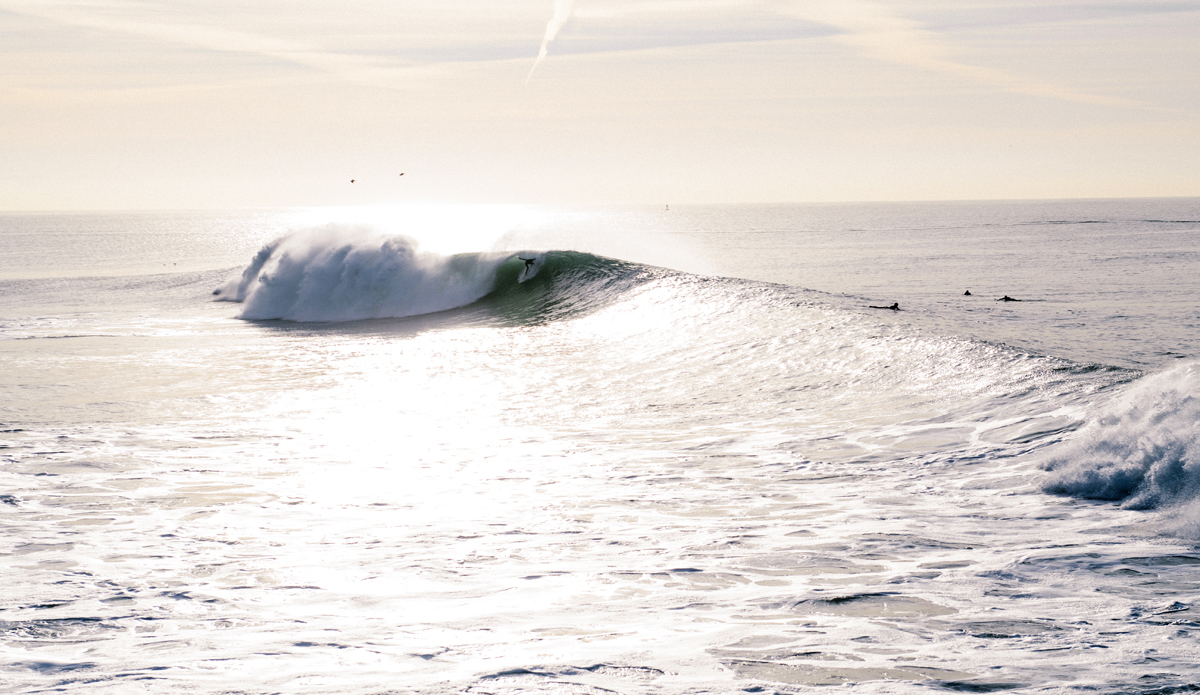 Dropping in on a nice dog ear of a wave. Photo: <a href=\"https://www.lookdontspeak.com\">Andrew Simoni</a>