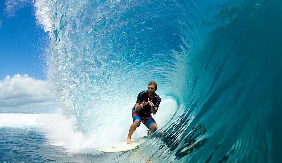 Cloudbreak is not an easy wave to shoot. It\'s a big playing field and it\'s always a challenge to line up. After a long morning of swimming and a few trips getting beat down the entire reef, I managed to be in the right spot for this beast that Gade locked into. It was the only good shot of the session. Photo: <a href=\"https://sethderoulet.com/\" target=_blank>Seth de Roulet</a>