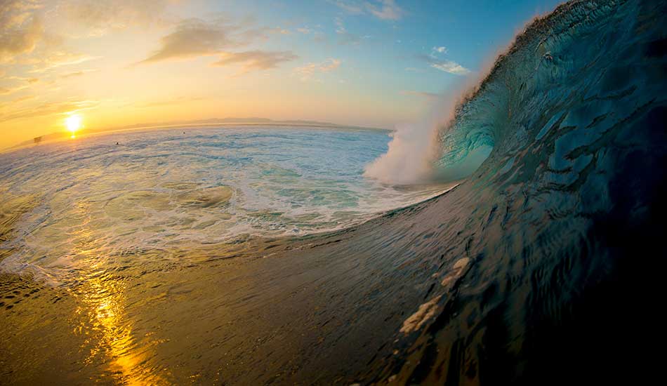 Morning sunrise behind the tower and an eight-foot bomb rattling the reef. Needless to say it got my heart pumping. Photo: <a href=\"https://sethderoulet.com/\" target=_blank>Seth de Roulet</a>