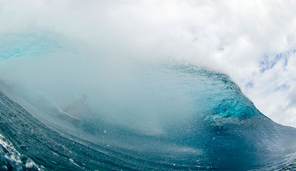 Billy Kemper getting spat on half way through a big second reef, Teahupoo bender. This is nowhere near the exit and that means Billy is going to have to negotiate the warping west bowl blind. Photo: <a href=\"https://sethderoulet.com/\" target=_blank>Seth de Roulet</a>