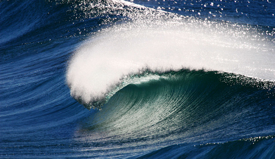 LIGHT GLOW - LENNOX HEAD.
I was meant to be shooting a particular surfer on this day, and as I looked up the beach with my 600mm lens, I saw light hitting the waves a certain way so I shot this instead.  Photo: <a href=\"https://www.bluespherephotography.com\">Shelli Bankier</a>