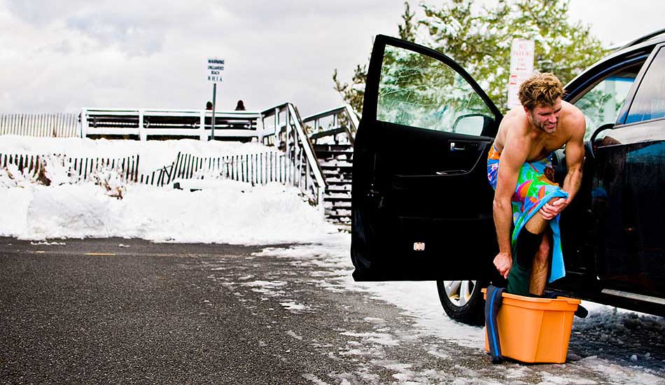 After all the dreamy lineups of snow on the beach, or the novelty of seeing someone covered in rubber, often we overlook the harsh reality of surfing in cold environments. When your arms are dead tired from a long-freezing session, the last thing you want to do is fumble to get out of a thick suit with no clothes on. Having to stand on ice makes it worse. But as the towel reminds us, clocking these hours is what allows us to escape to tropical paradises in the not too distant future. Photo: <a href=\"https://trevormoran.com/\">Trevor Moran</a>
