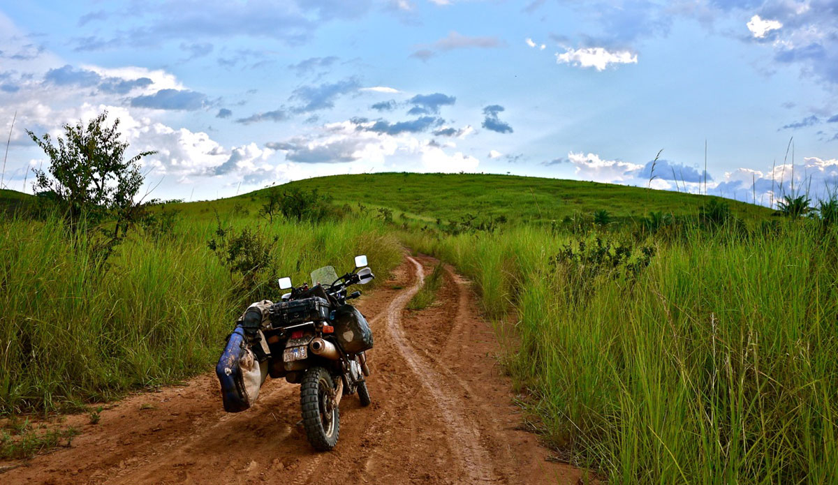 A slippery road ahead the in the congo. Photo: <a href=\"https://bugsonmyboard.org/\">Gary Conley</a>