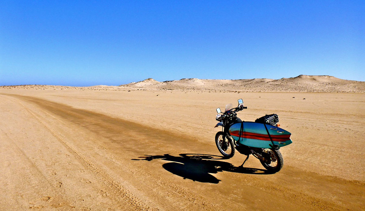 A long road ahead in the Sahara Desert. Photo: <a href=\"https://bugsonmyboard.org/\">Gary Conley</a>