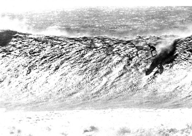 Greg Noll's legendary big wave at Makaha as captured by Alby Falzon