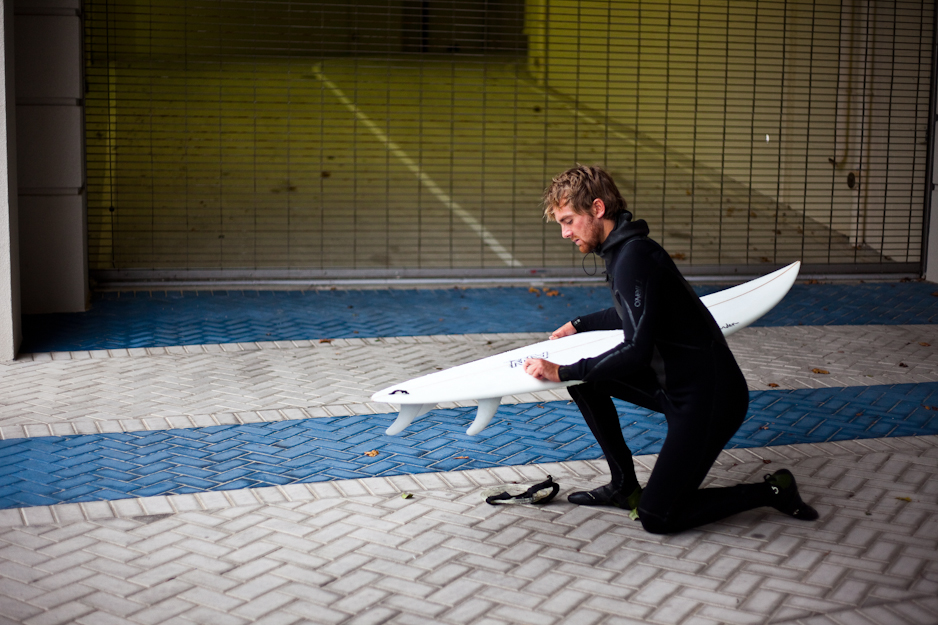 Waxing the surfboard: the grandaddy of all surf rituals. Tyler Vaughan demonstrates. Photo: Ryan Struck.