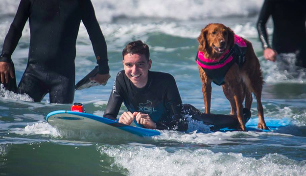 Caleb and Ricochet enjoying some rollers in San Diego. Photo: Dale Porter | Facebook: Surf Dog Ricochet
