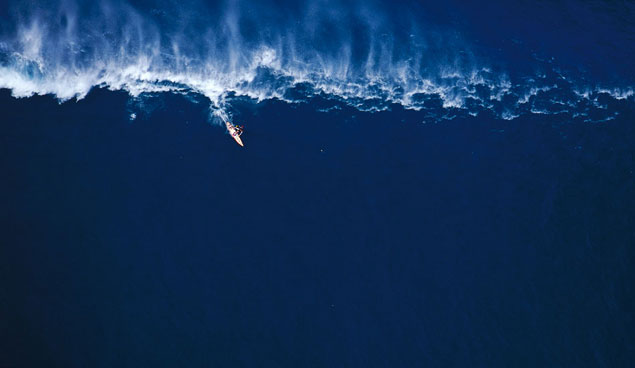 Garrett McNamara tow-surfing big waves at Outside Avalanche. Photo: Sean Davey