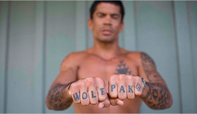 Kala's 'WOLF PAK' tattoo and his fists are processed by separate sets of brain regions depending on if you focus on the letters or his fingers.