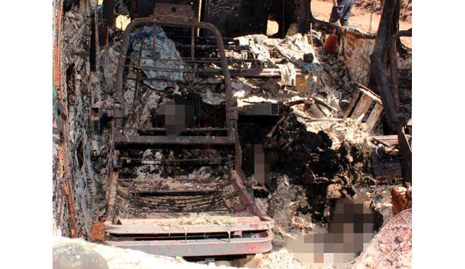 The inside of the torched van. The remains have been blurred. Picture: Noroeste.com/Carlos Chaidez