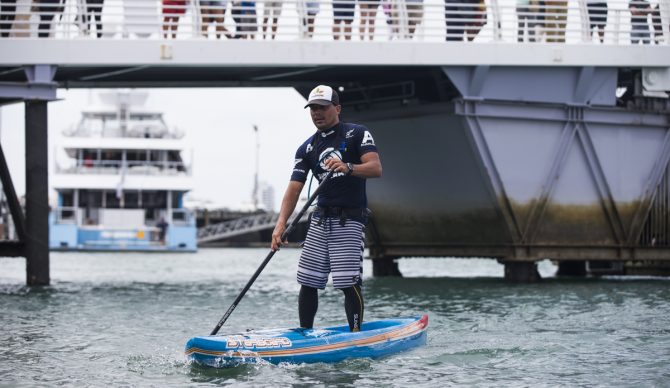 Tahiti's Manoa Drollet finishes a flatwater paddle race in Auckland, New Zealand. Photo: Mike Smolowe