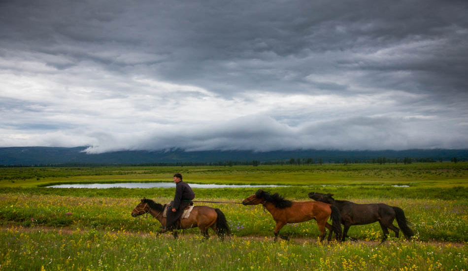 Sometimes a photograph can make something look idyllic and calm, when the reality is that it was neither. I had been traveling by horseback through some very remote parts of Mongolia, and had been battling swarming horse flies, bot flies, mosquitos, and when the bugs were gone, there was weather. Here, we were pushing our tired horses to escape a swarm of horse flies after a 12 hour ride through a rain storm.