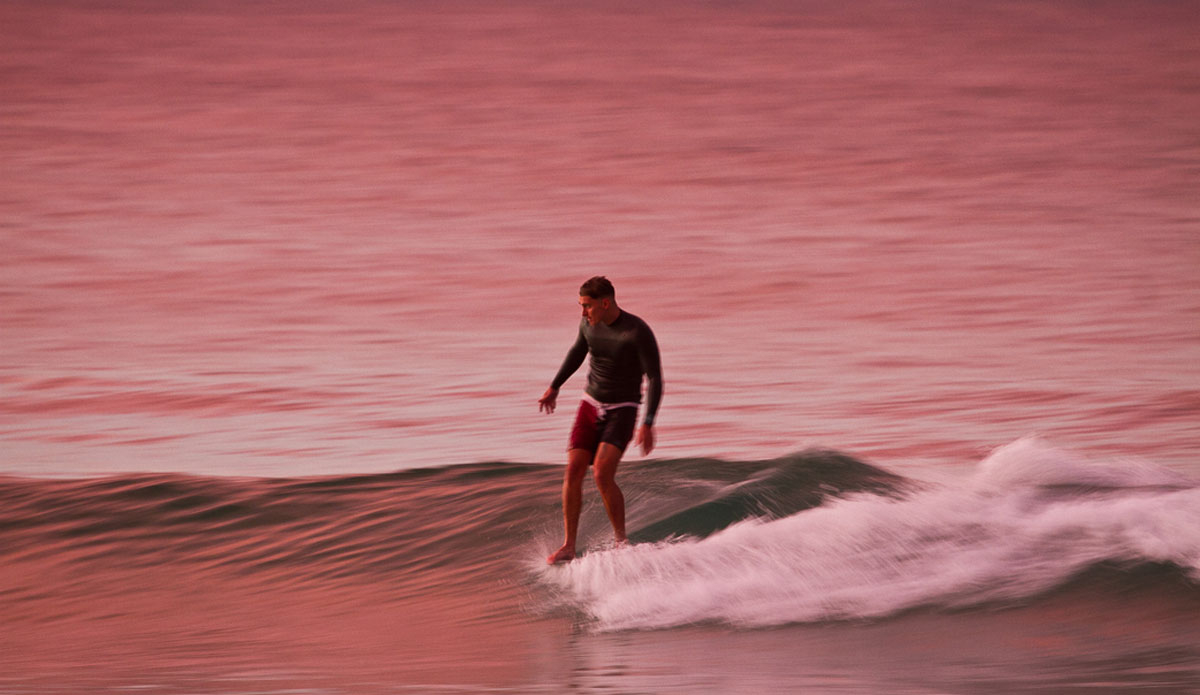 February: Sam Crookshank bathed in afternoon light at First Point, Noosa Heads. Photo:<a href=\"https://www.narrowpathmedia.com.au/#0\"> Andrew Carruthers</a>