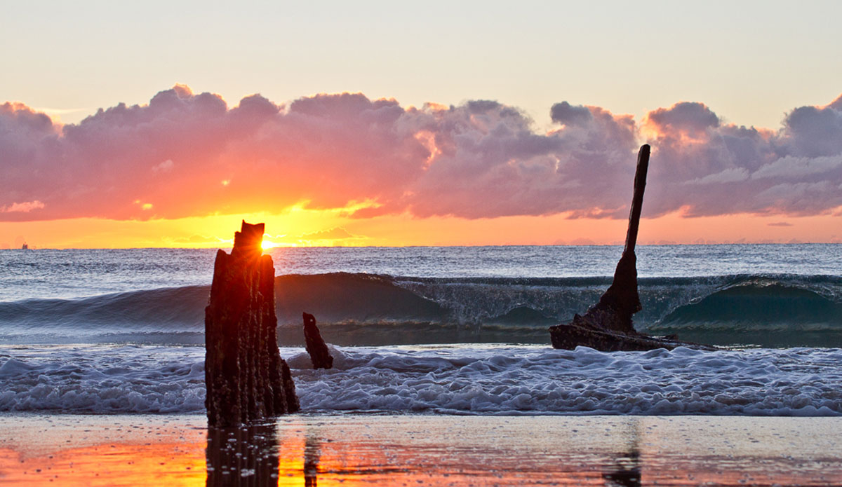 July: Dicky Caloundra. Winter Sunrise over the SS. Photo:<a href=\"https://www.narrowpathmedia.com.au/#0\"> Andrew Carruthers</a>