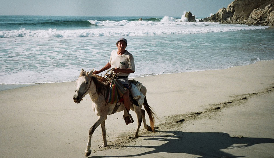 Guy on a horse at Spot X, quizzically examining us and our tiny Chevy half buried in the sand. Photo: <a href=\"https://mattdegreff.com/\" target=_blank>Matt Degreff</a>.