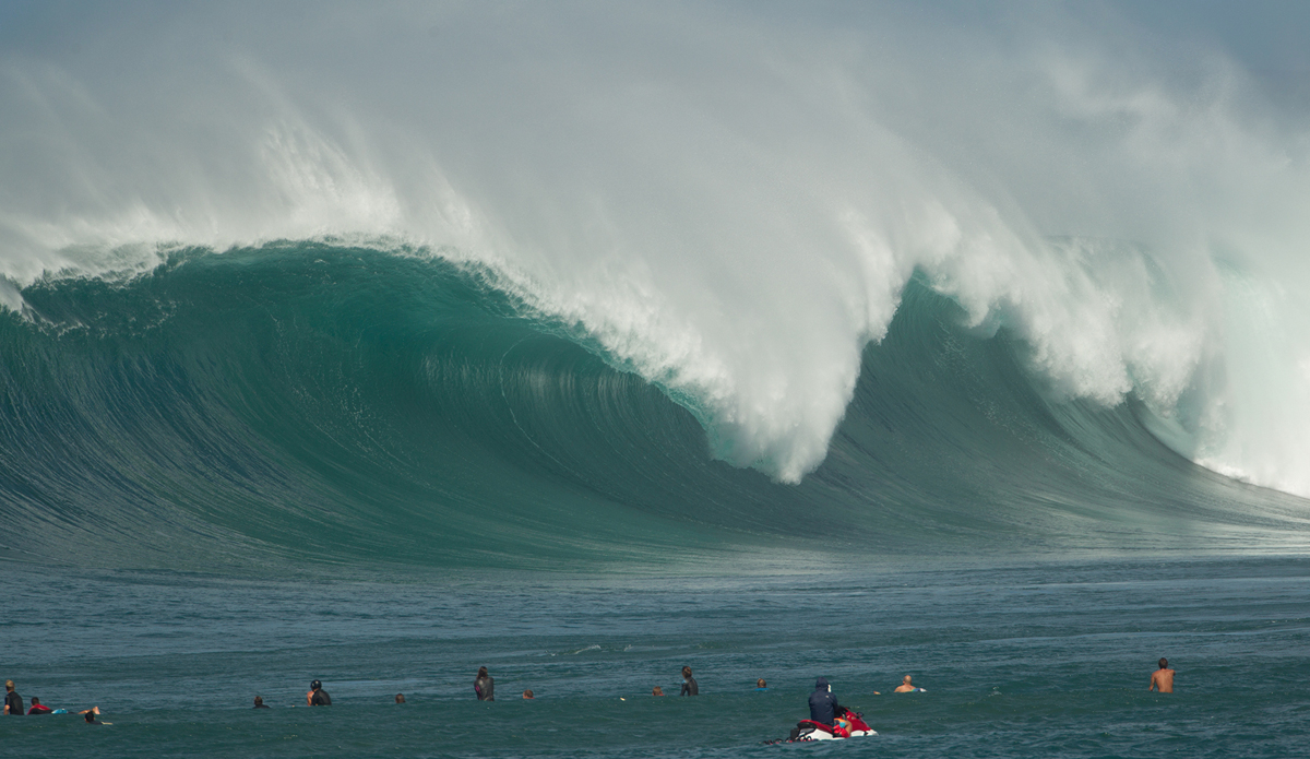 Waimea Bay lineup  shot. This is far out from a friend\'s roof. It\'s as close to a water angle from the beach as you can get. This one went unridden. Photo: <a href=\"https://www.brianbielmann.com\">BrianBielmann.com</a>
