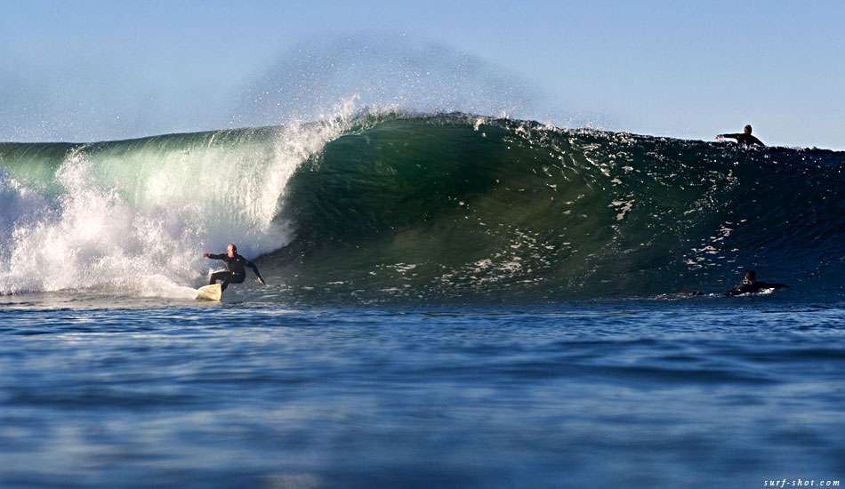 After failed attempts to shoot the angle looking up the face of the wave, I succeeded in having the falling lip unzip my wetsuit.  It immediately filled with 50-something-degree water, which hampered my ability to swim. The legs of my wetsuit filled up like water balloons and Velcro fin leashes kept the water from draining out of the bottom. I eventually staggered up on the beach much to the amusement of a handful on onlookers.  Photo: Chuck Schmid/<a href=\"https://surf-shot.com/\" target=\"_blank\">Surf-Shot.com</a>