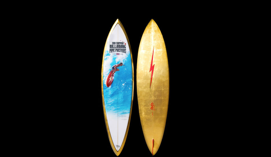 This is the final set of photos of the finished trophy board for Billabong\'s \'200 Pipeline Masters. The deck is a painting reproduction of a \'70\'s Jeff Divine photo of Gerry Lopez. Gerry shaped the 7\'2\" Pipeline Gun single fin. The \'08 board was black, the \'09 board Red, and this year Billabong wanted yellow, so I made it gold leaf to take it over the top. I have to keep raising the bar each year. I already have ideas of topping this one for next year.