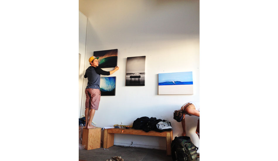 Before. Zach Weisberg attempting to hang The Canvas Wave Prints on the wall.