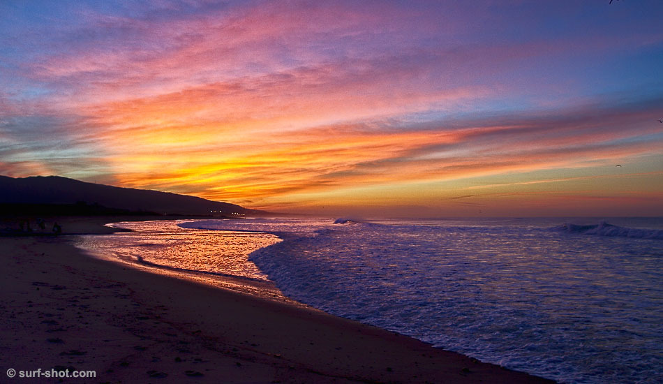 This is at 6:30 AM at the Surfing America Prime Contest at Uppers. It’s 40-something degrees outside, but there was an awesome sunrise. Weekend warriors are going surfing, young competitors are checking in at the contest, and everyone is quiet for a moment watching the colors in the sky. Photo: <a href=\"https://www.surf-shot.com\" target=_blank>Surf-Shot.com</a>