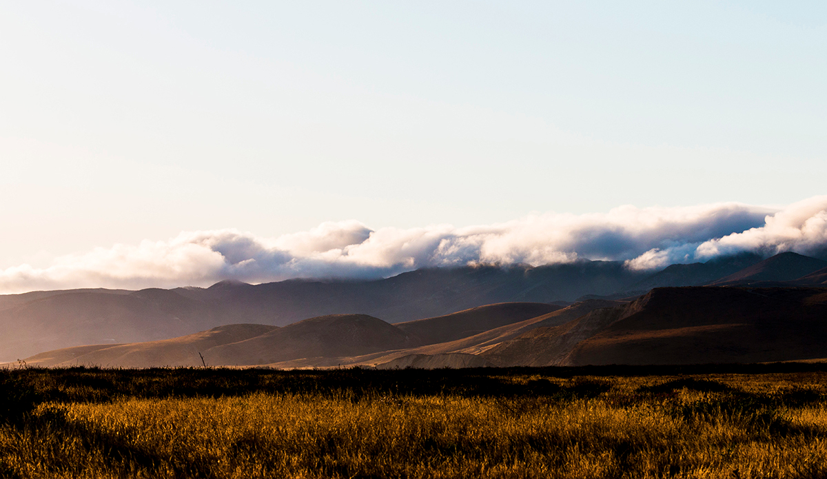 These rolling hills ran into the ocean, holding back a dense layer of clouds and allowing the sun to shine all day—the stars shone all night, too.  Photo: <a href=\"https://www.corygehrphoto.com/\">Cory Gehr Photography</a>