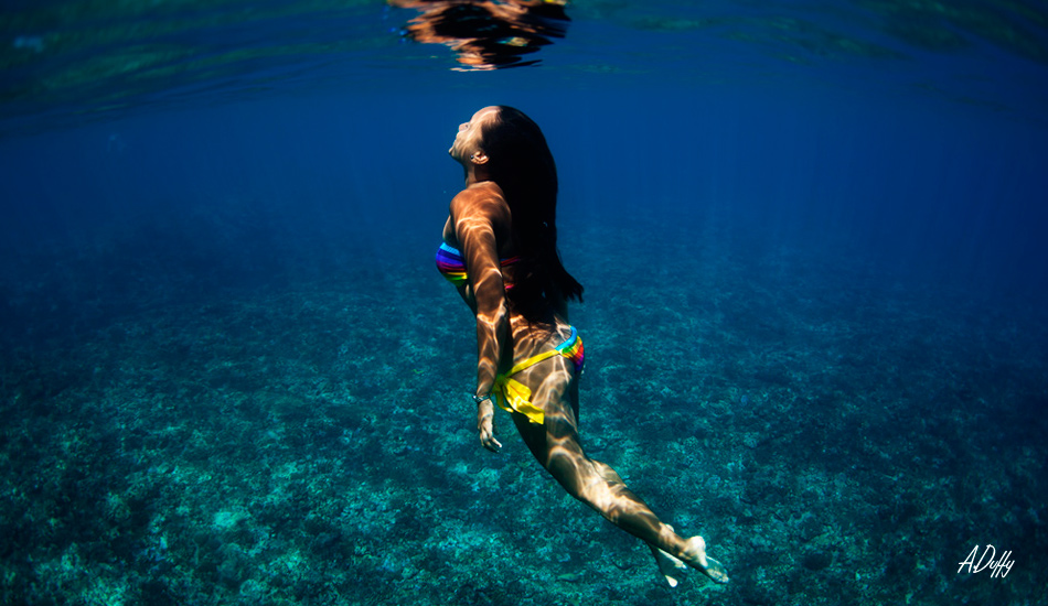 A local girl (vahine) swimming out. Teahupoo, Tahiti. Photo: <a href=\"https://adamduffyphotography.com/\">Adam Duffy.</a>