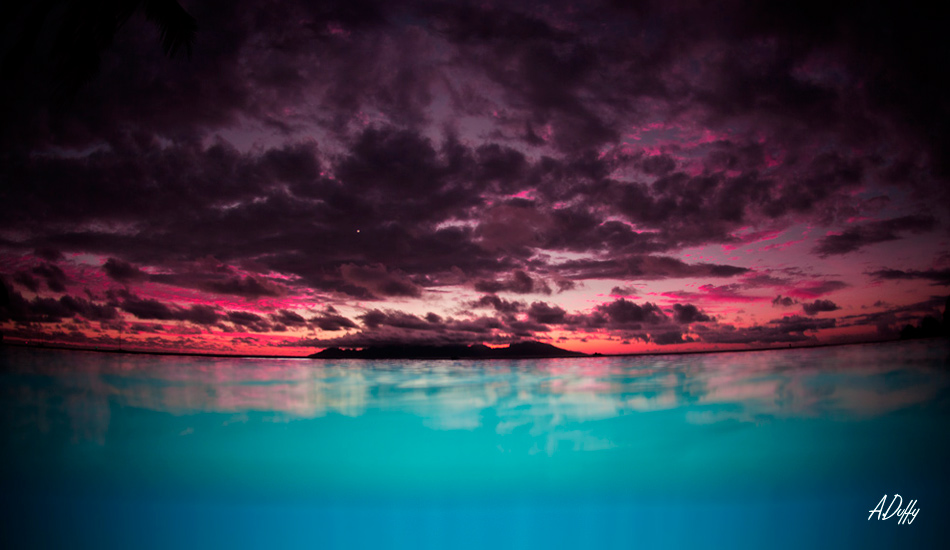 Beautiful sunsets are a daily occurrence in Tahiti. Here, I\'ve filled the aqua-blue water with my underwater flash system. Photo: <a href=\"https://adamduffyphotography.com/\">Adam Duffy.</a>