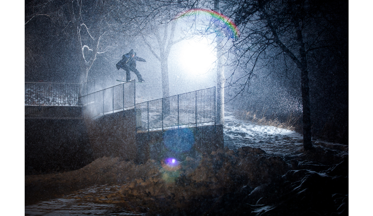 Harrison Gordon with a boardslide, drop to transfer in on a snowy Minnesota night.  It was snowing so much this night that by the time we left the spot there was a new 5 inches on the ground after just one session.  When we woke up in the morning the first news was that it snowed so much during the night the roof of the Metronome stadium collapsed.  It turned out to the be the start of the biggest single snowfall Minneapolis had ever received. Photo: <a href=\"https://www.adammoran.com/\">Adam Moran</a>