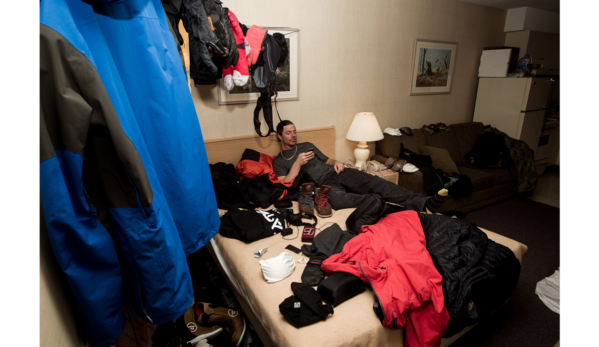 My friends at home thing a lot of my travel is glamorous and to nice mountain towns like Aspen. They rarely get to see the reality of shitty dirty motel rooms that get turned into drying racks each night. Jeremy Jones takes a minute to facetime with the kids in Stewart BC while everything he owns dries out after a long day sledding. Photo: <a href=\"https://www.adammoran.com/\">Adam Moran</a>