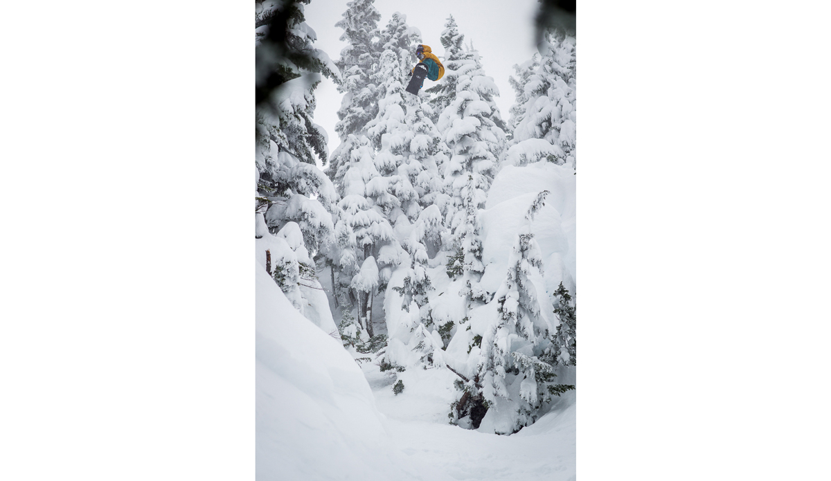 There is an old shot of Marc Morrisett ollieng through the trees in Whistler and I think every photographer has tried in some way to copy that shot.  Its one of those photos you look at and wish it was you doing it.  This is probably my closest interpretation of that photo, except I don’t know if Id ever cross court a pillow gap like Nicolas Mueller, here at Stevens Pass Washington. Photo: <a href=\"https://www.adammoran.com/\">Adam Moran</a>