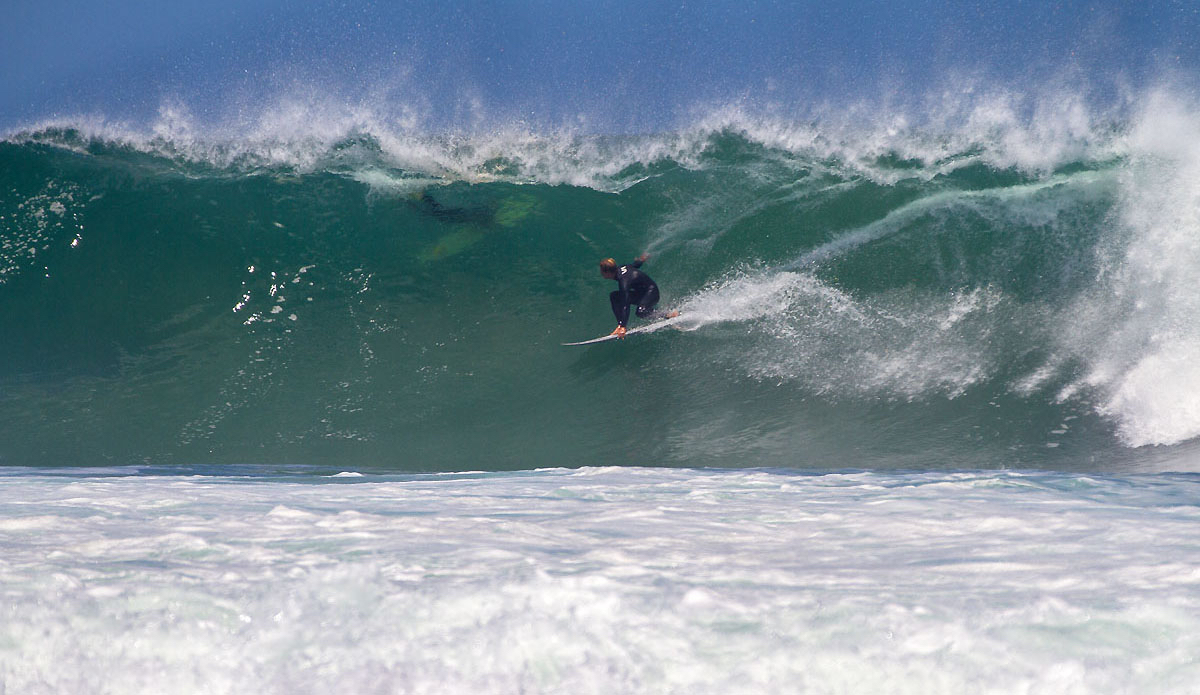 Simon Fish locked in on the point. It\'s super powerful wave that comes from deep water and throws itself over the reef.