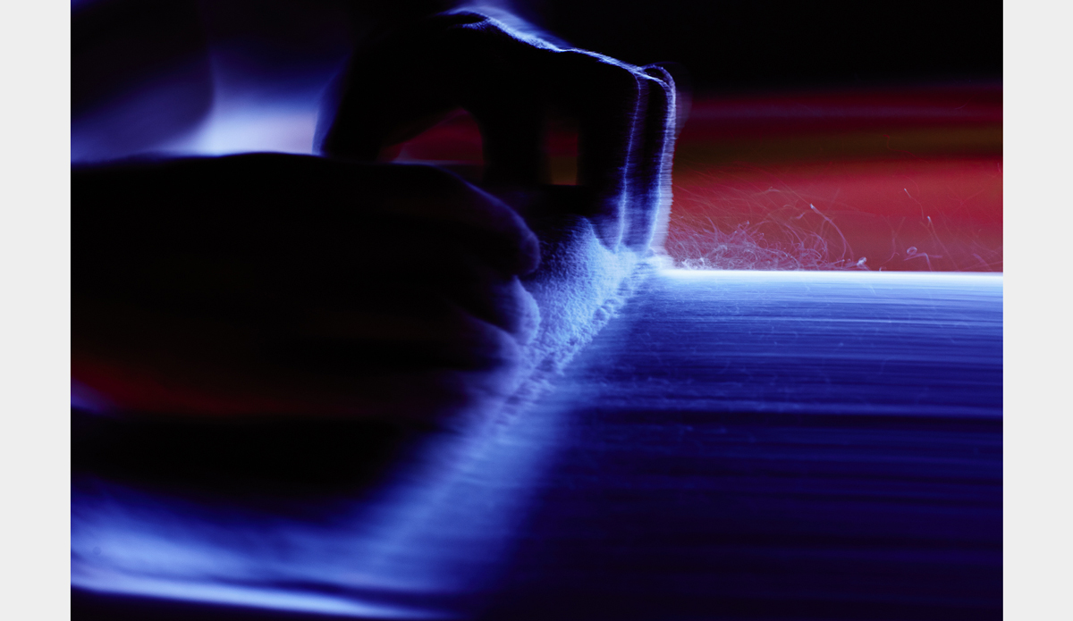 Another shaping shot in the shed of Ian Zamora. The cool thing with shooting blurs is low light is never the enemy, unlike the majority of other photography techniques. Photo: <a href=\"https://www.facebook.com/chrisdelorenzophotography\">Chris DeLorenzo</a>