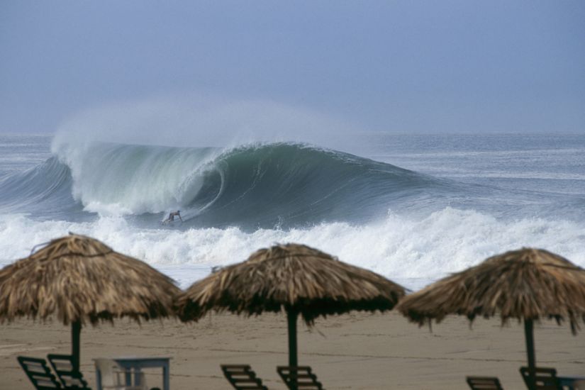 August 1996 - On a visit to the famed Zicatela beachbreak in Oaxaca, Mexico we endured 10 days of relative flatness.  Then one morning we awoke to find a fresh 8-10 foot swell detonating on the sandbars, and Puerto Rican charger Carlos Cabrero knew just what to do with all that auqatic energy. Photo: <a href=\"https://stevefitzpatrick.com/\" target=_blank>Steve Fitzpatrick</a>