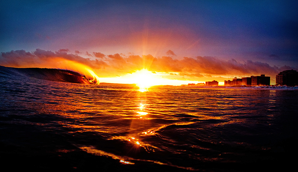 The time between when the sun dropped below that cloud line and when it dipped under the horizon was 14 minutes. Fourteen minutes swimming around with this incredible light. It just gives you an idea of what happens when everything comes together. Stormfront, sunset, perfect a-frame that pitched enough, and me in the right place at the right time. Photo: <a href=\"https://clarkography.com/\" target=_blank>Matt Clark.</a>