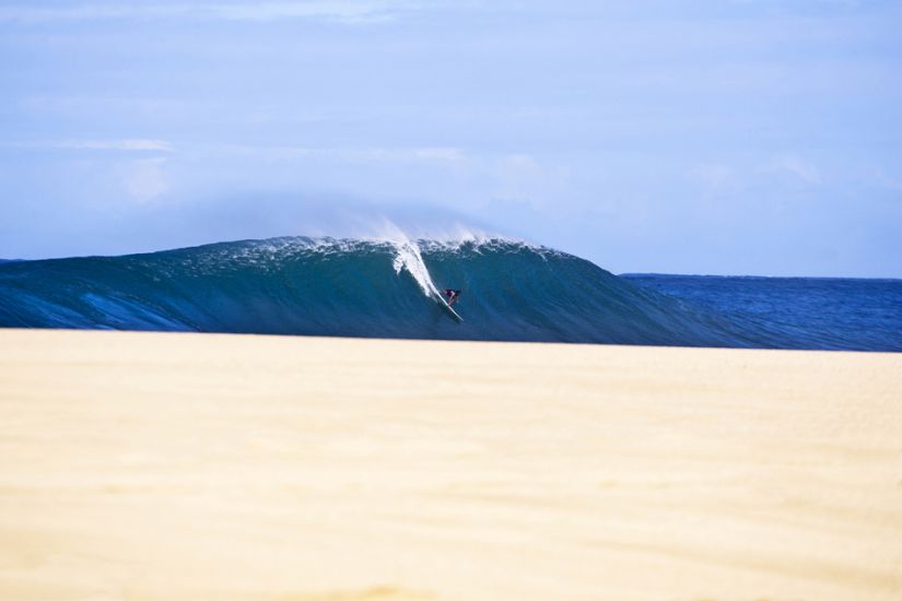 Magnum Martinez on a Pipeline Bomb. I shot this well before all the sand had been washed away. Laying down and just waiting for it to all line up. The sand was gone soon after. One of my best Hawaii shots. Photo: <a href=\"https://www.natesmithphoto.com/\" target=_blank>Nate Smith</a>